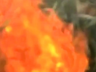 Asian bodybuilder barely covered at the beach